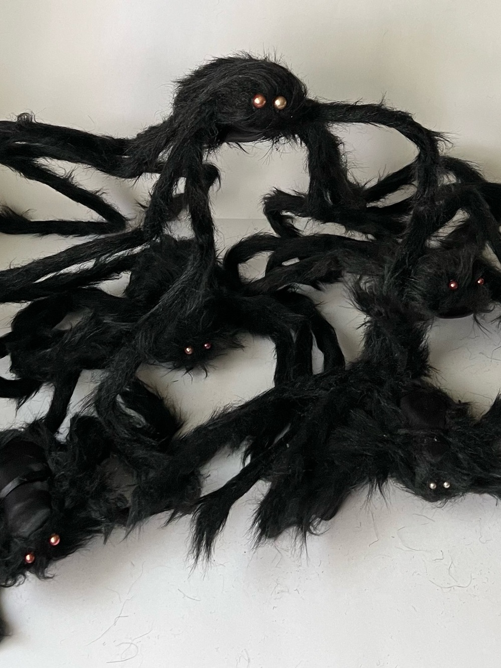 Set of five large furry poseable black Halloween spiders